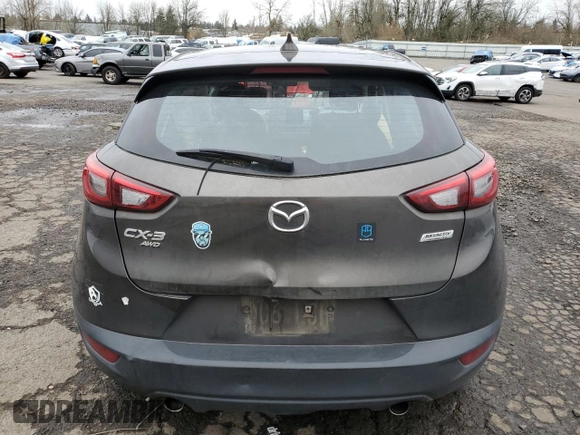 2018 Mazda CX-3 Sport z VIN JM1DKFB77J0312732, wystawiony jako Copart lot #45720065 z przebiegiem 99 866 mil mil oraz Szkoda całkowita • Salvage title. Historia ofert i sprzedaży dostępna na DreamBid. Obrazek 6.