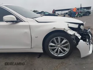 2015 Infiniti Q50 Premium z VIN JN1BV7AP9FM331131, wystawiony jako IAAI lot #41786108 z przebiegiem 176 874 mil mil oraz . Historia ofert i sprzedaży dostępna na DreamBid. Obrazek 17.