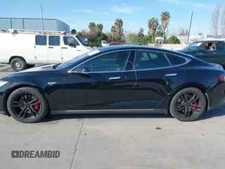 2014 Tesla Model S P85D with VIN 5YJSA1H22EFP65530, listed as a IAAI auction lot 41959941 with 76,532 mi miles and . Bid and sale history available at DreamBid. Image 14.