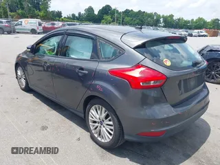 2016 Ford Focus Titanium with VIN 1FADP3N20GL275763, listed as a IAAI auction lot 42511959 with 124,891 mi miles and . Bid and sale history available at DreamBid. Image 3.