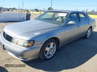 1999 Infiniti Q45 z VIN JNKBY31A8XM603290, wystawiony jako IAAI lot #41668113 z przebiegiem 144 251 mil mil oraz . Historia ofert i sprzedaży dostępna na DreamBid. Obrazek 2.
