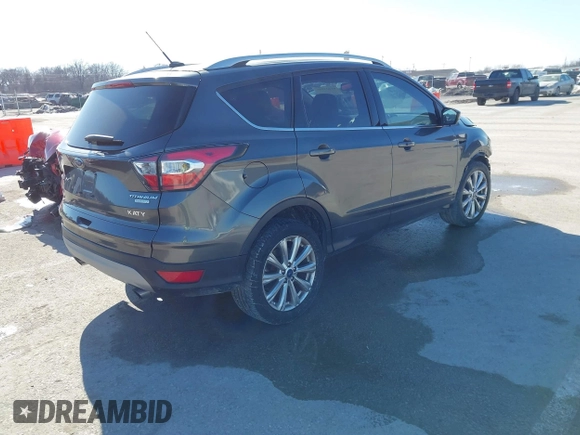 2017 Ford Escape Titanium with VIN 1FMCU0J92HUA26226, listed as a IAAI auction lot 41423259 with 111,076 mi miles. Bid and sale history available at carsss.com. Image 4.