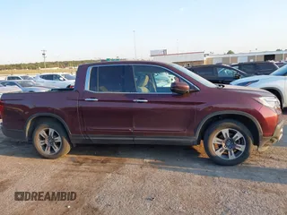 2017 Honda Ridgeline RTL-E with VIN 5FPYK3F74HB029959, listed as a IAAI auction lot 40530840 with 95,596 mi miles and . Bid and sale history available at DreamBid. Image 13.