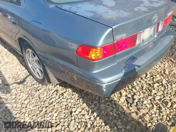 2000 Toyota Camry CE z VIN JT2BG22K5Y0476098, wystawiony jako IAAI lot #42200385 z przebiegiem Nie podano mil oraz . Historia ofert i sprzedaży dostępna na DreamBid. Obrazek 14.