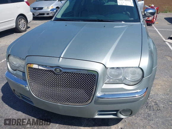 2006 Chrysler 300 C with VIN 2C3LA63H26H130160, listed as a IAAI auction lot 42170192 with 124,206 mi miles. Bid and sale history available at carsss.com. Image 6.