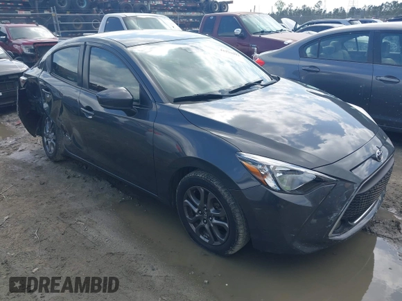 2019 Toyota Yaris L z VIN 3MYDLBYV4KY528641, wystawiony jako IAAI lot #41935993 z przebiegiem 61 940 mil mil oraz . Historia ofert i sprzedaży dostępna na DreamBid. Obrazek 1.
