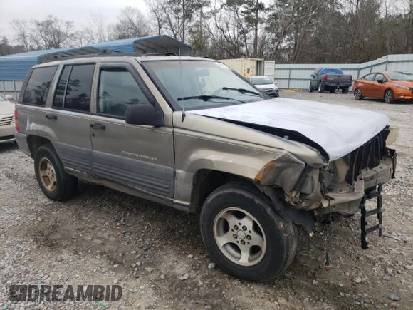 1996 Jeep Grand Cherokee Laredo with VIN 1J4FX58S5TC248122, listed as a Copart auction lot 45843935 with 295,521 mi miles and Salvage Title. Bid and sale history available at carsss.com. Image 4.