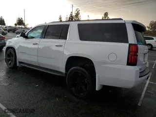 2015 Chevrolet Suburban LS with VIN 1GNSCHKC9FR667540, listed as a Copart auction lot 80908574 with 125,428 mi miles and Salvage Title. Bid and sale history available at carsss.com. Image 2.