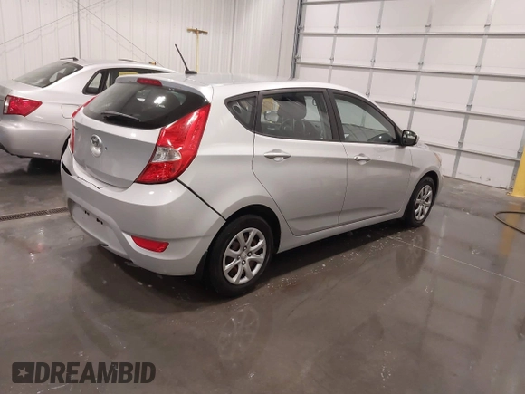 2014 Hyundai Accent GS with VIN KMHCT5AE4EU150877, listed as a IAAI auction lot 41989235 with 68,918 mi miles. Bid and sale history available at carsss.com. Image 4.