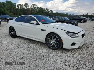 2014 BMW M6 z VIN WBSLX9C51ED160143, wystawiony jako Copart lot #73044214 z przebiegiem 91 717 mil mil oraz Szkoda całkowita • Salvage title. Historia ofert i sprzedaży dostępna na DreamBid. Obrazek 4.