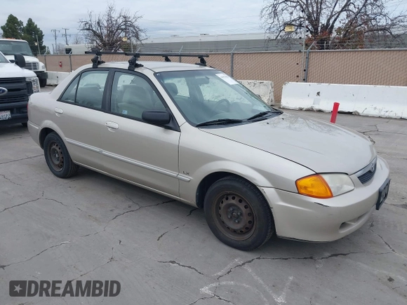 2000 Mazda Protege DX with VIN JM1BJ2223Y0212144, listed as a IAAI auction lot 41570436 with 221,430 mi miles and . Bid and sale history available at DreamBid. Image 1.