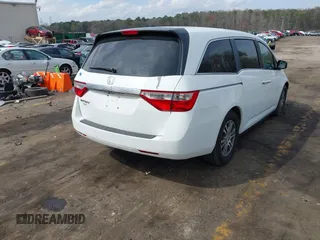 2011 Honda Odyssey EX-L with VIN 5FNRL5H67BB070541, listed as a IAAI auction lot 41812554 with 150,898 mi miles and . Bid and sale history available at DreamBid. Image 4.