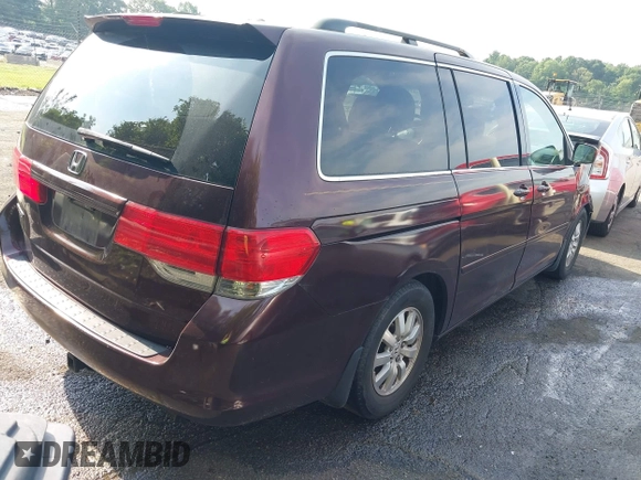 2010 Honda Odyssey EX with VIN 5FNRL3H59AB103405, listed as a IAAI auction lot 42442253 with 129,784 mi miles and . Bid and sale history available at DreamBid. Image 4.