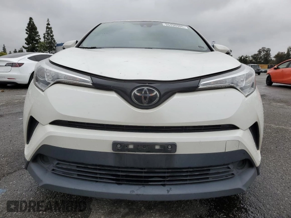 2019 Toyota C-HR XLE z VIN JTNKHMBX7K1028552, wystawiony jako Copart lot #55490905 z przebiegiem 127 397 mil mil oraz Szkoda całkowita • Salvage title. Historia ofert i sprzedaży dostępna na DreamBid. Obrazek 5.