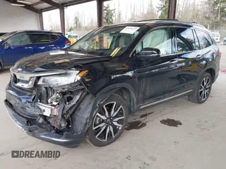 2021 Honda Pilot Elite with VIN 5FNYF6H04MB043014, listed as a IAAI auction lot 41826931 with 63,546 mi miles and . Bid and sale history available at DreamBid. Image 2.