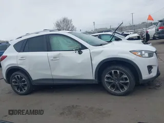 2016 Mazda CX-5 Grand Touring z VIN JM3KE2DY8G0885006, wystawiony jako IAAI lot #41615873 z przebiegiem 118 890 mil mil oraz . Historia ofert i sprzedaży dostępna na DreamBid. Obrazek 13.