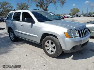 2010 Jeep Grand Cherokee Laredo with VIN 1J4PS4GK3AC163307, listed as a IAAI auction lot 41681527 with 155,464 mi miles. Bid and sale history available at carsss.com. Image 1.