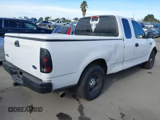 2000 Ford F-150 XL with VIN 1FTZX1727YKA78887, listed as a IAAI auction lot 41291272 with 289,343 mi miles. Bid and sale history available at carsss.com. Image 4.