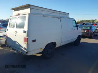 1995 GMC Vandura z VIN 1GTEG25K5SF548518, wystawiony jako IAAI lot #40664471 z przebiegiem 157 506 mil mil oraz . Historia ofert i sprzedaży dostępna na DreamBid. Obrazek 4.