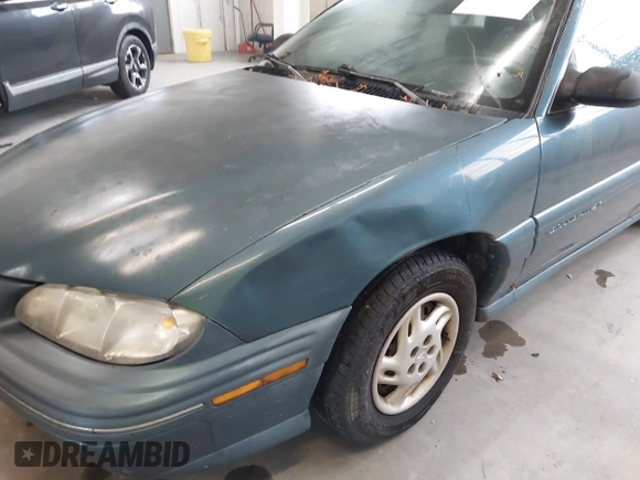 1998 Pontiac Grand Am SE with VIN 1G2NE52T1WC768383, listed as a IAAI auction lot 42220195 with 275,908 mi miles and . Bid and sale history available at DreamBid. Image 6.