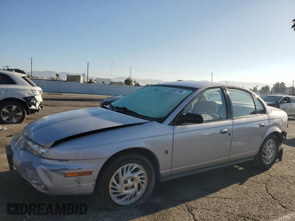 1999 Saturn SL with VIN 1G8ZK5274XZ367394, listed as a Copart auction lot 63863795 with 73,197 mi miles and Salvage title. Bid and sale history available at DreamBid. Image 1.