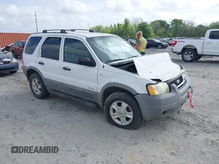 2002 Ford Escape XLT Choice with VIN 1FMYU03102KB44453, listed as a IAAI auction lot 41951739 with 331,792 mi miles and . Bid and sale history available at DreamBid. Image 1.
