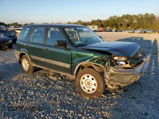 2000 Honda CR-V LX with VIN JHLRD1848YC038520, listed as a Copart auction lot 74137634 with 104,332 mi miles and Salvage Title. Bid and sale history available at carsss.com. Image 4.