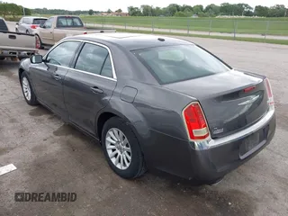 2013 Chrysler 300 with VIN 2C3CCAAG9DH707447, listed as a IAAI auction lot 42292077 with 171,329 mi miles and . Bid and sale history available at DreamBid. Image 3.