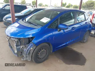 2015 Honda Fit LX z VIN 3HGGK5H51FM711607, wystawiony jako IAAI lot #42249495 z przebiegiem Nie podano mil oraz . Historia ofert i sprzedaży dostępna na DreamBid. Obrazek 18.