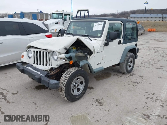 1998 Jeep Wrangler SE with VIN 1J4FY29P9WP793260, listed as a IAAI auction lot 41596990 with 90,766 mi miles. Bid and sale history available at carsss.com. Image 2.
