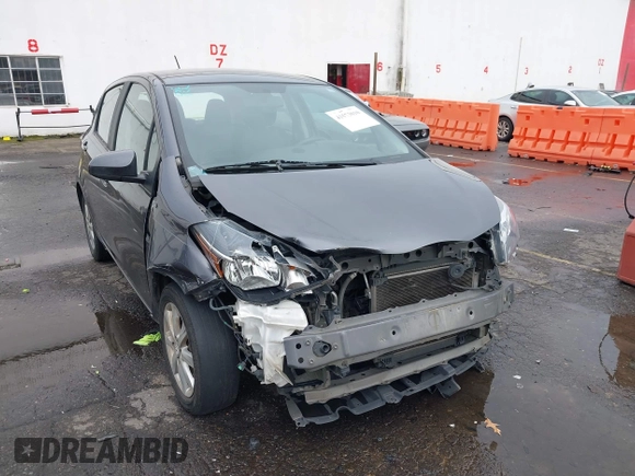 2015 Toyota Yaris L with VIN VNKKTUD38FA043393, listed as a IAAI auction lot 41573010 with 107,146 mi miles and . Bid and sale history available at DreamBid. Image 6.