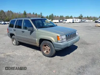 1997 Jeep Grand Cherokee Laredo with VIN 1J4GZ58S7VC713517, listed as a IAAI auction lot 42062214 with 205,533 mi miles. Bid and sale history available at carsss.com. Image 1.
