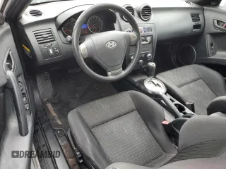 2008 Hyundai Tiburon GS z VIN KMHHM66D68U288062, wystawiony jako Copart lot #58261695 z przebiegiem 130 310 mil mil oraz Tytuł czysty. Historia ofert i sprzedaży dostępna na DreamBid. Obrazek 8.