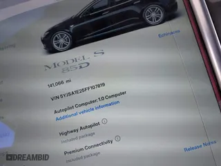 2015 Tesla Model S 85D with VIN 5YJSA1E25FF107819, listed as a IAAI auction lot 41333556 with 141,066 mi miles. Bid and sale history available at carsss.com. Image 7.