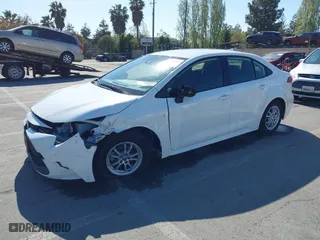 2021 Toyota Corolla Hybrid LE with VIN JTDEAMDE6MJ032371, listed as a IAAI auction lot 42086942 with 68,335 mi miles. Bid and sale history available at carsss.com. Image 2.