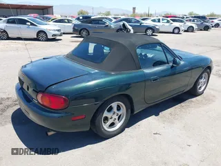 1999 Mazda MX-5 Miata with VIN JM1NB3530X0103644, listed as a IAAI auction lot 42524948 with Not provided miles and . Bid and sale history available at DreamBid. Image 4.