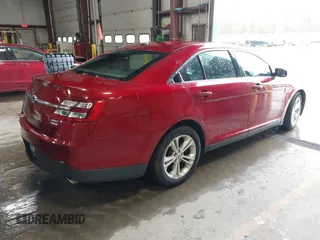2013 Ford Taurus SEL with VIN 1FAHP2E99DG180535, listed as a IAAI auction lot 41741619 with 193,665 mi miles and . Bid and sale history available at carsss.com. Image 4.