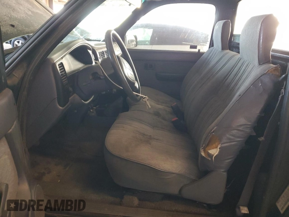 1999 Toyota Tacoma z VIN 4TANL42N6XZ561222, wystawiony jako Copart lot #45721925 z przebiegiem 221 521 mil mil oraz Szkoda całkowita • Salvage title. Historia ofert i sprzedaży dostępna na DreamBid. Obrazek 7.