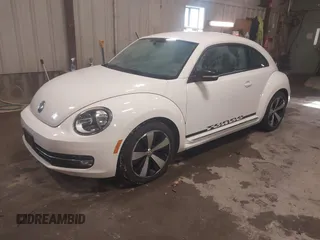 2012 Volkswagen Beetle 2.0T Turbo PZEV with VIN 3VWVA7AT4CM603293, listed as a IAAI auction lot 41633664 with 91,410 mi miles. Bid and sale history available at carsss.com. Image 2.