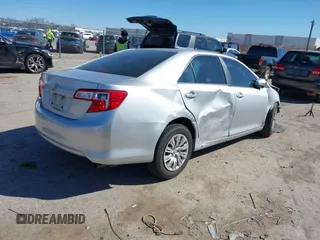 2014 Toyota Camry L with VIN 4T1BF1FK7EU856848, listed as a IAAI auction lot 41729604 with 100,148 mi miles. Bid and sale history available at carsss.com. Image 4.