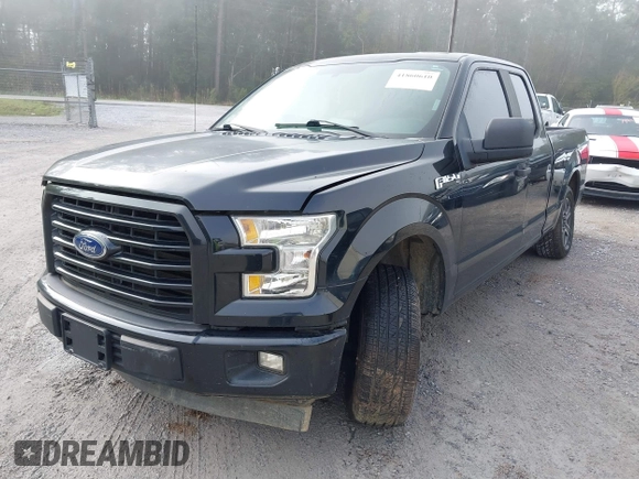 2015 Ford F-150 XL with VIN 1FTEX1CF2FKD12874, listed as a IAAI auction lot 41860610 with 242,215 mi miles. Bid and sale history available at carsss.com. Image 2.