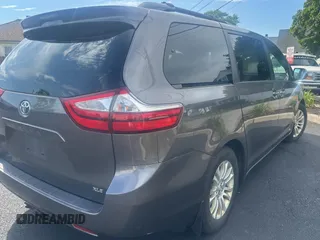 2015 Toyota Sienna XLE with VIN 5TDYK3DC5FS567460, listed as a Copart auction lot 63311295 with 296,433 mi miles and Clean title. Bid and sale history available at DreamBid. Image 4.