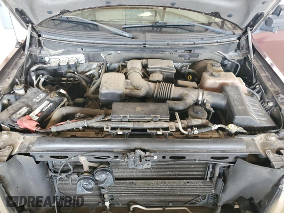 2010 Ford F-150 XL with VIN 1FTFX1CV0AFA82944, listed as a Copart auction lot 62912345 with 104,967 mi miles and Salvage title. Bid and sale history available at DreamBid. Image 11.