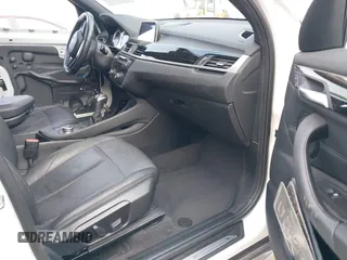 2018 BMW X1 sDrive28i with VIN WBXHU7C38J5L05985, listed as a IAAI auction lot 42014649 with 77,082 mi miles. Bid and sale history available at carsss.com. Image 5.