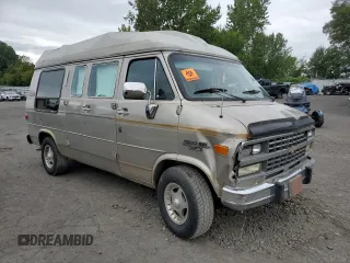 1992 Chevrolet Chevy Van z VIN 1GBEG25K2N7130047, wystawiony jako Copart lot #68682724 z przebiegiem 143 585 mil mil oraz Szkody całkowita. Historia ofert i sprzedaży dostępna na DreamBid. Obrazek 4.