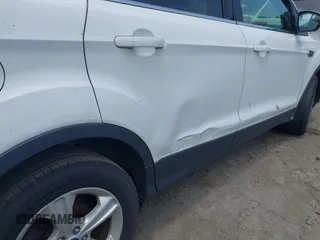 2014 Ford Escape SE z VIN 1FMCU9GX1EUD66666, wystawiony jako IAAI lot #42571222 z przebiegiem Nie podano mil oraz . Historia ofert i sprzedaży dostępna na DreamBid. Obrazek 6.