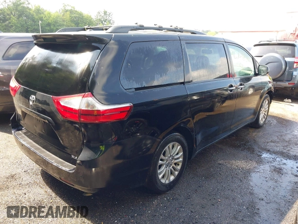 2015 Toyota Sienna XLE with VIN 5TDYK3DC8FS574645, listed as a IAAI auction lot 42528851 with 164,408 mi miles and . Bid and sale history available at DreamBid. Image 4.
