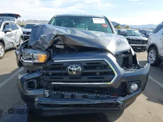 2018 Toyota Tacoma SR with VIN 5TFRX5GN8JX116802, listed as a IAAI auction lot 41879503 with 86,448 mi miles and . Bid and sale history available at DreamBid. Image 6.