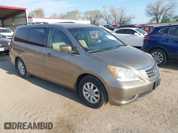 2010 Honda Odyssey EX-L with VIN 5FNRL3H79AB048049, listed as a IAAI auction lot 42055090 with 142,736 mi miles. Bid and sale history available at carsss.com. Image 1.