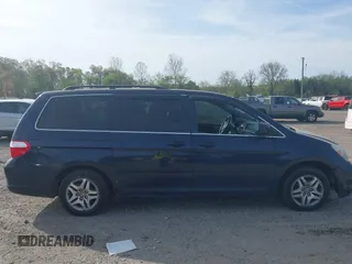 2005 Honda Odyssey EX with VIN 5FNRL38455B135555, listed as a IAAI auction lot 42080079 with 149,468 mi miles and . Bid and sale history available at carsss.com. Image 13.
